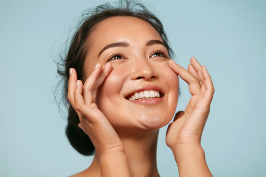 Woman with glowing healthy skin after skincare routine